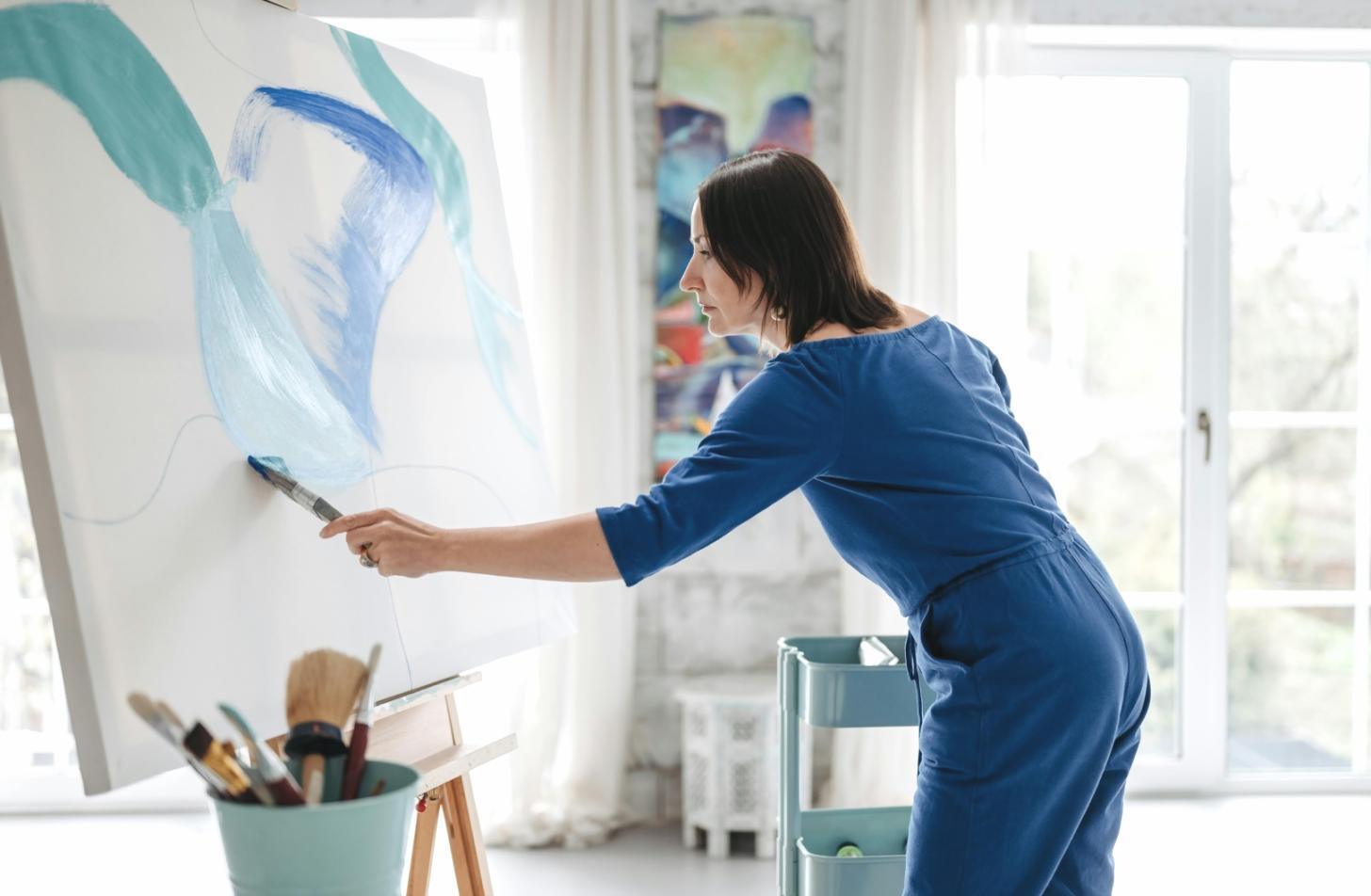 Student working on character sketches with instructor feedback notes visible on screen